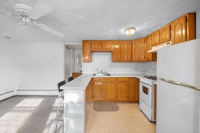 kitchen featuring ceiling fan, white appliances, and sink