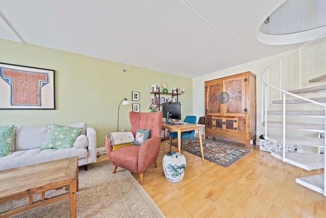61 Broad Reach Unit T62B, Weymouth, MA 02191 - living area featuring stairs, wood finished floors, a textured ceiling, and a desk