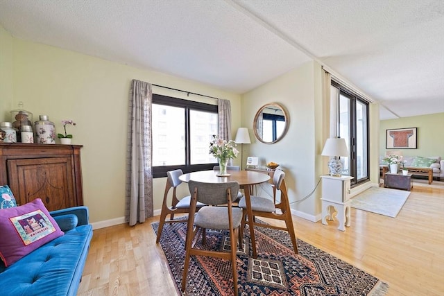 61 Broad Reach Unit T62B, Weymouth, MA 02191 - dining area with light wood finished floors, a textured ceiling, and baseboards