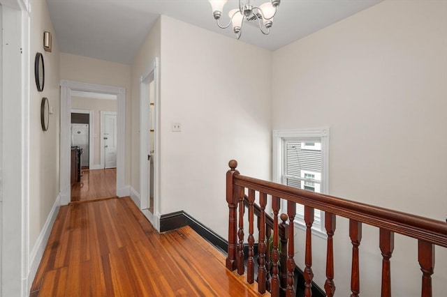 46 Farquhar Unit 2, Boston, MA 02131 - corridor featuring an upstairs landing, a chandelier, wood finished floors, and baseboards