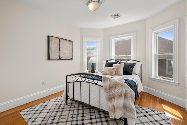 46 Farquhar Unit 2, Boston, MA 02131 - bedroom featuring baseboards and wood finished floors