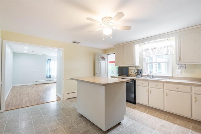 19 Zabelle Ave, Auburn, MA 01501 - kitchen with a sink, a baseboard heating unit, dishwasher, and a center island