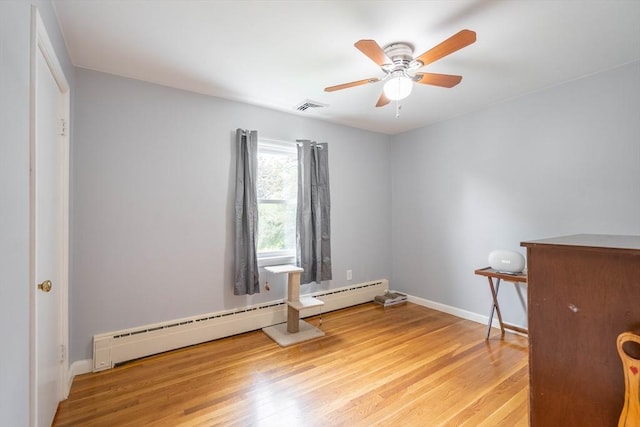 19 Zabelle Ave, Auburn, MA 01501 - spare room featuring a baseboard heating unit, wood finished floors, ceiling fan, and baseboards