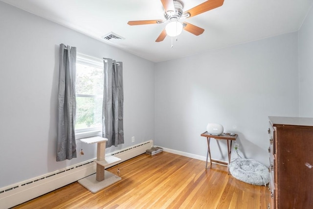 19 Zabelle Ave, Auburn, MA 01501 - unfurnished room with wood finished floors, baseboard heating, baseboards, and ceiling fan