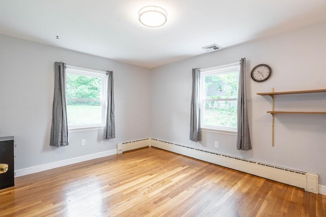 19 Zabelle Ave, Auburn, MA 01501 - spare room featuring wood finished floors, a baseboard radiator, and baseboards