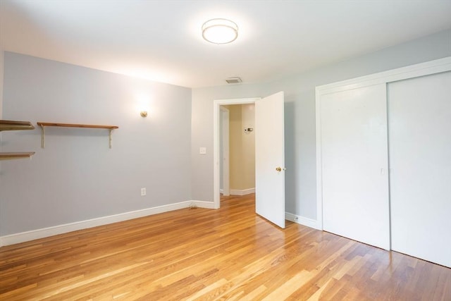 19 Zabelle Ave, Auburn, MA 01501 - unfurnished bedroom featuring light wood-style flooring, a closet, and baseboards