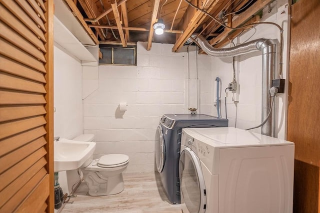 19 Zabelle Ave, Auburn, MA 01501 - laundry room featuring washing machine and dryer, light wood-style flooring, and a sink