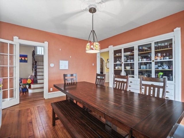 743 Bridge St, Lowell, MA 01850 - dining space featuring french doors, stairs, and wood-type flooring