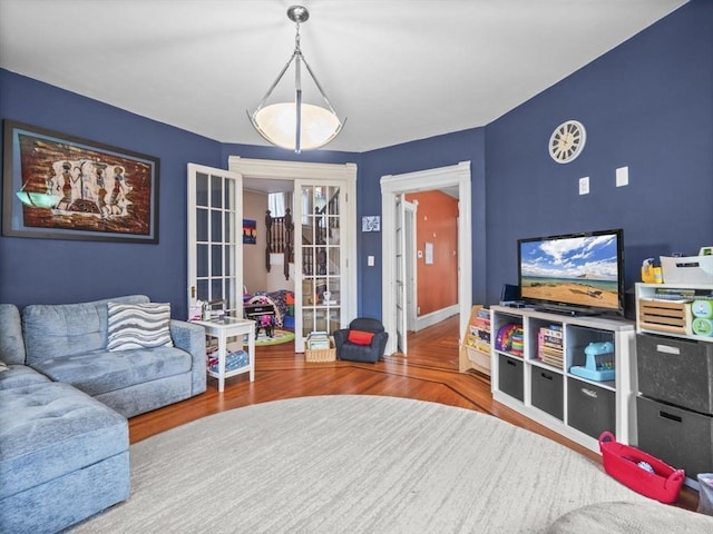 743 Bridge St, Lowell, MA 01850 - living area featuring wood finished floors and french doors