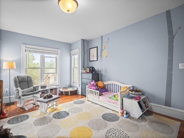 743 Bridge St, Lowell, MA 01850 - bedroom featuring wood finished floors and baseboards