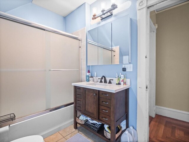 743 Bridge St, Lowell, MA 01850 - full bathroom with vanity and bath / shower combo with glass door
