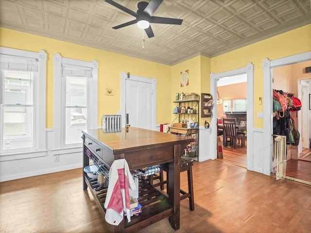 743 Bridge St, Lowell, MA 01850 - dining room with an ornate ceiling, wood finished floors, a ceiling fan, and plenty of natural light