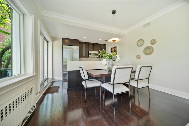 56 Commonwealth Ave Ph, Ph, Boston, MA 02116 - dining space with radiator, plenty of natural light, crown molding, baseboards, and dark wood finished floors