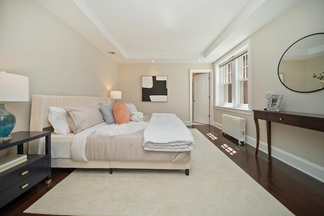 56 Commonwealth Ave Ph, Ph, Boston, MA 02116 - bedroom with radiator, dark wood-type flooring, a tray ceiling, baseboards, and recessed lighting