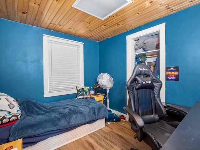 bedroom with hardwood / wood-style flooring and wooden ceiling