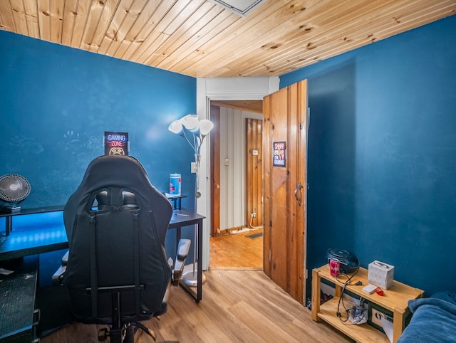 office featuring wooden ceiling and light hardwood / wood-style flooring