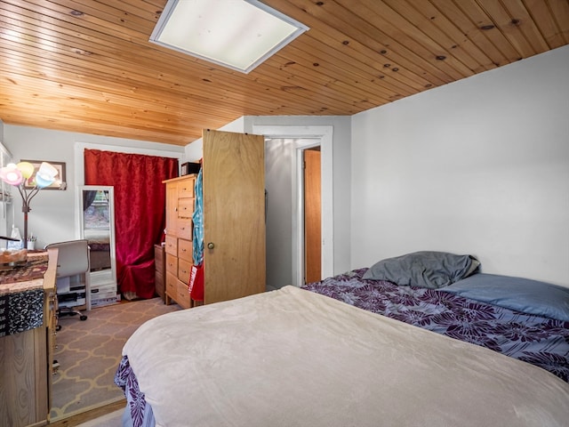 bedroom with carpet floors and wooden ceiling