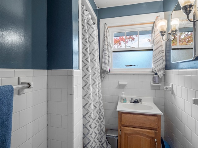 bathroom featuring tile walls and vanity