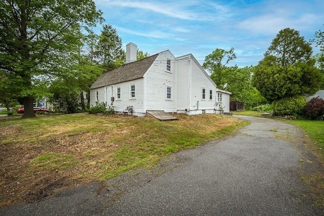 171 Hobart St, Danvers, MA 01923 - view of side of property featuring a chimney and a yard