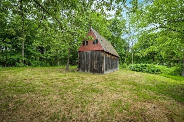 171 Hobart St, Danvers, MA 01923 - view of green lawn featuring a barn, an outbuilding, and a detached garage