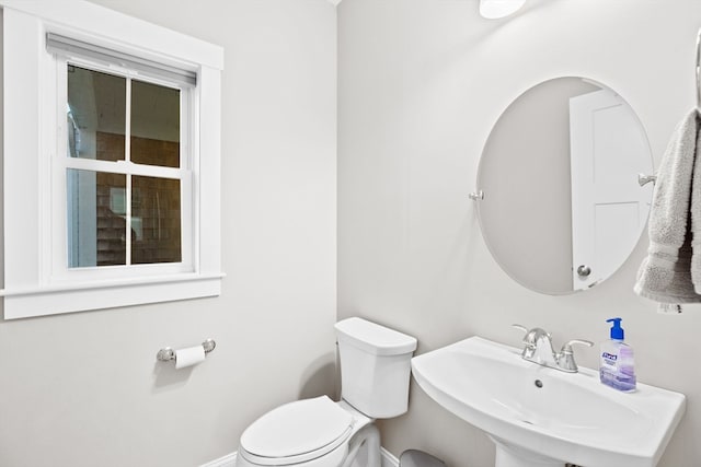 bathroom featuring toilet and sink