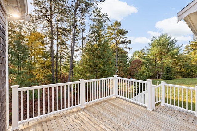 wooden terrace with a lawn