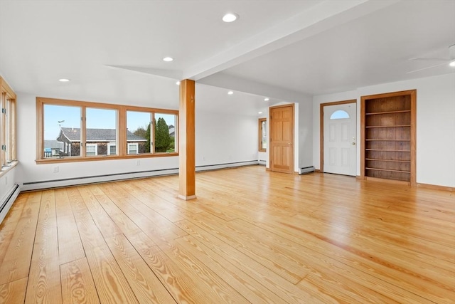 unfurnished living room with a wealth of natural light and recessed lighting