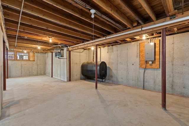 unfinished basement with heating fuel and electric panel