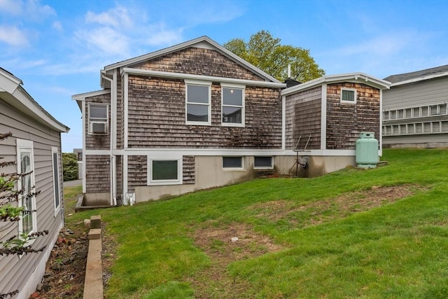 view of side of home with a yard