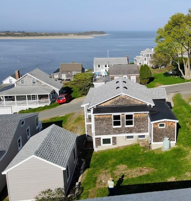 birds eye view of property with a water view