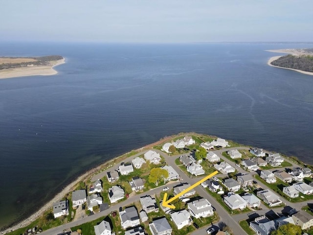 drone / aerial view with a water view and a residential view