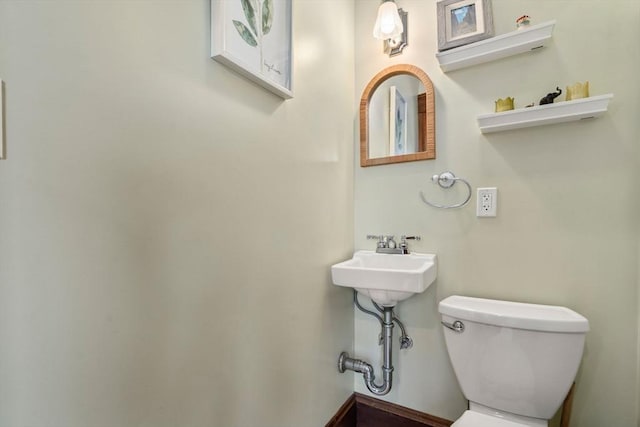 half bath featuring toilet