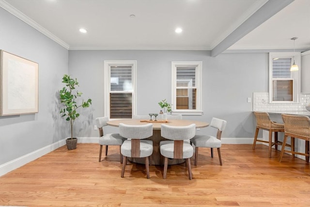 dining room featuring crown molding, recessed lighting, light wood-style floors, and baseboards