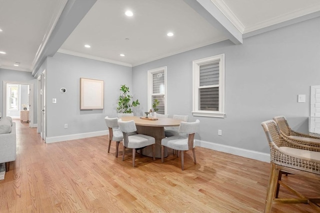 dining room with crown molding, recessed lighting, baseboards, and light wood finished floors