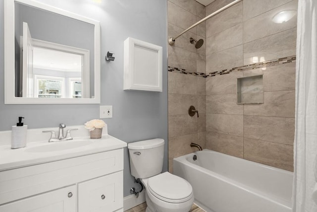 bathroom with vanity, shower / bath combination with curtain, and toilet