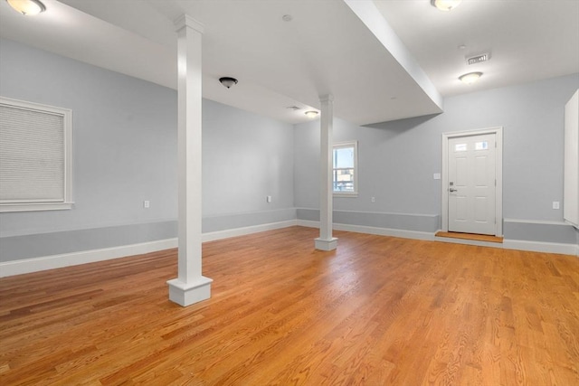 below grade area featuring light wood-style floors, baseboards, and visible vents