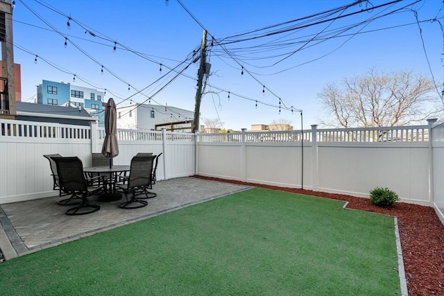 view of yard featuring a fenced backyard and a patio area