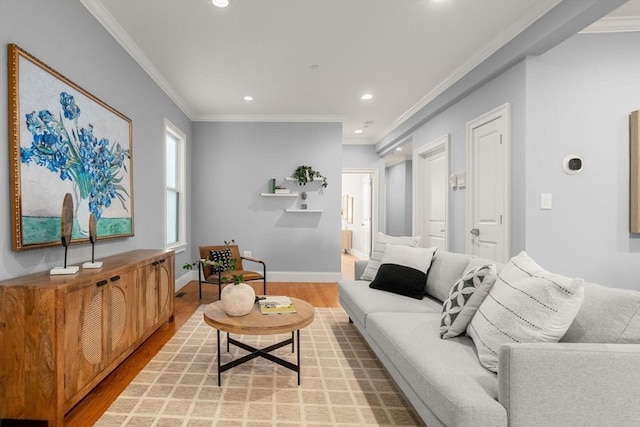 living area with light wood-style floors, baseboards, crown molding, and recessed lighting