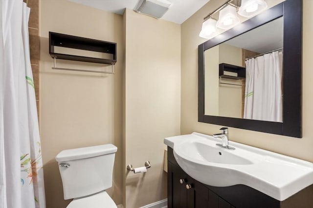 bathroom with vanity, toilet, and a wall unit AC