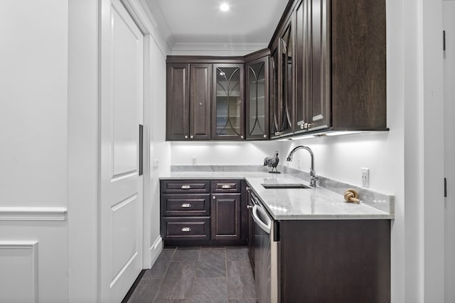 kitchen featuring dark tile flooring, light stone counters, dark brown cabinets, and sink