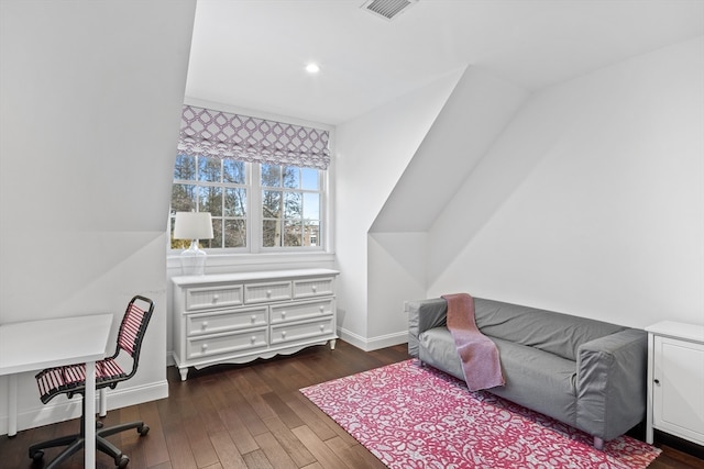 bedroom with dark wood-type flooring and lofted ceiling