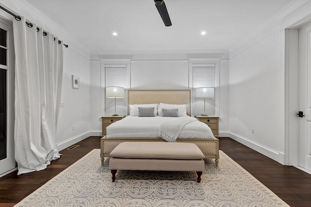 bedroom with ceiling fan, dark wood-type flooring, and crown molding