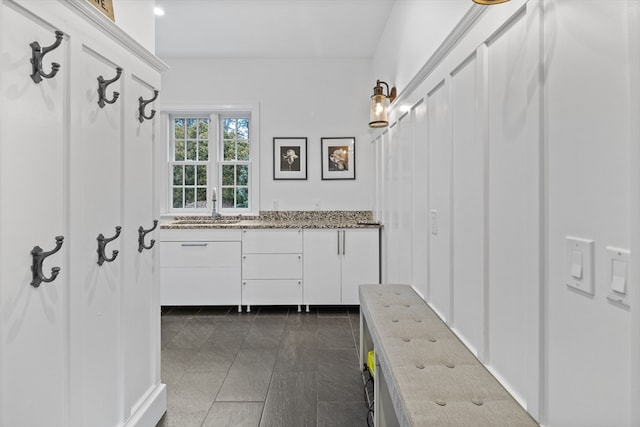 bathroom with tile flooring and vanity