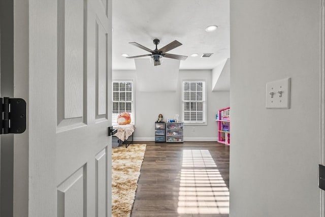 rec room with ceiling fan and dark hardwood / wood-style floors