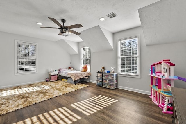 bedroom with ceiling fan and dark hardwood / wood-style floors