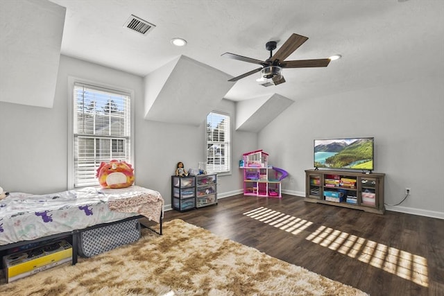 bedroom with lofted ceiling, dark hardwood / wood-style floors, and ceiling fan