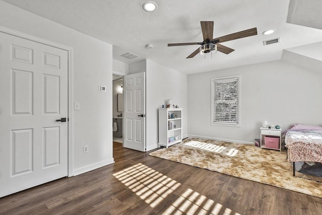 bedroom featuring dark hardwood / wood-style flooring and ceiling fan