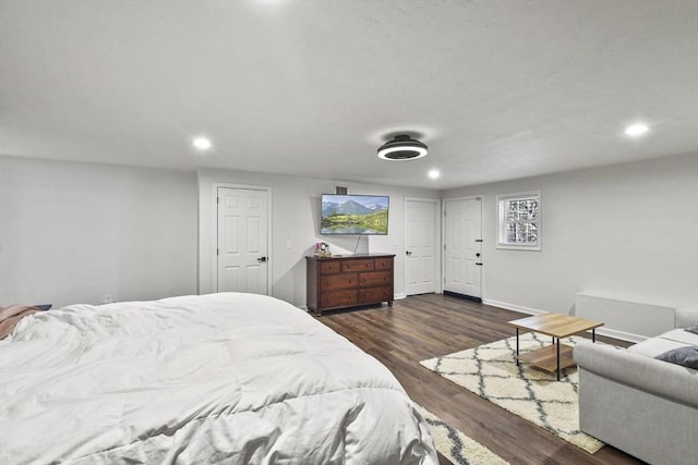 bedroom with dark wood-type flooring