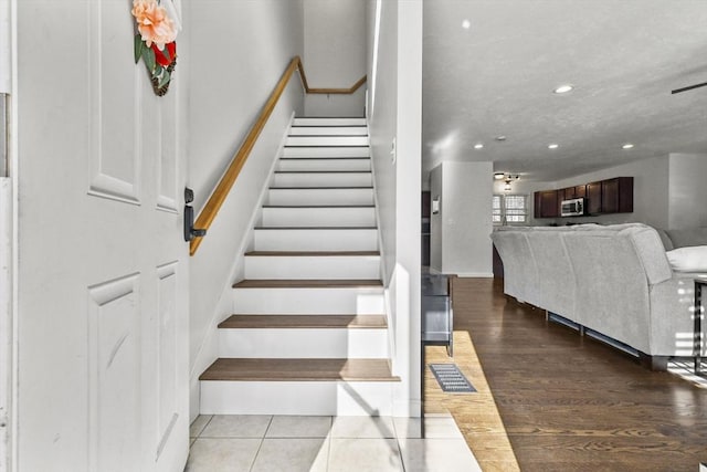 staircase with tile patterned flooring