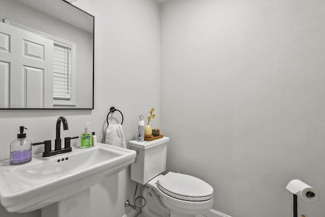 bathroom with toilet and sink